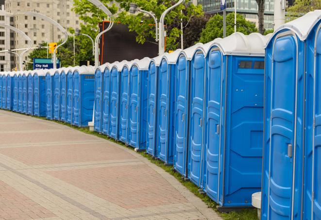 portable restrooms with sink and hand sanitizer stations, available at a festival in Drexel Hill